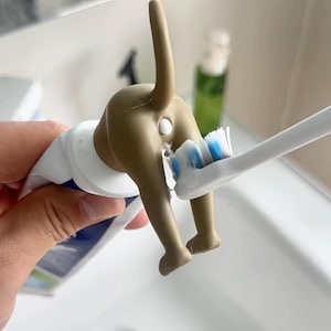 Pooping Dog Toothpaste Cap