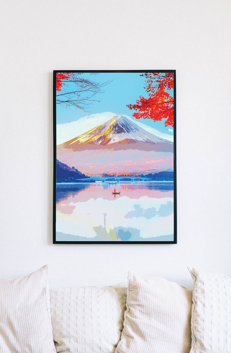 Puede incluir: Una pintura que representa el monte Fuji con su reflejo en un lago. La monta&ntilde;a est&aacute; cubierta de nieve y el lago est&aacute; rodeado de &aacute;rboles con hojas rojas.