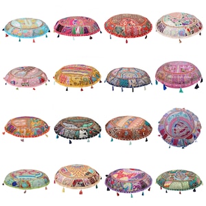 Könnte beinhalten: Sortiment von 12 runden Bodenkissen mit bunten Patchwork-Stoffen und Quastenbesatz. Die Kissen sind aus Baumwolle und mit einem weichen, komfortablen Material gefüllt.