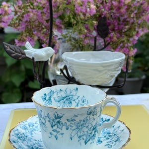 Vintage Queen&#39;s China Teacup & Saucer: Blue Floral Embossed Design, Made in England
