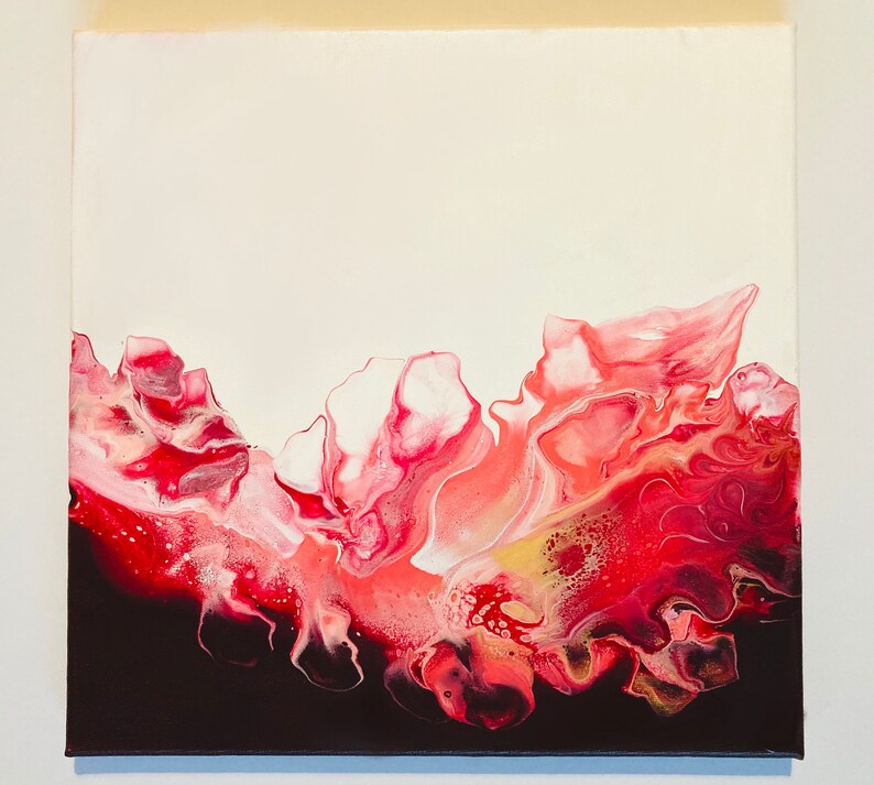 May include: Abstract painting with a white background and a red, pink, and gold design. The design resembles a wave or a flower.