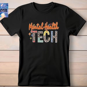 May include: Black t-shirt with the text "Mental Health Tech" in colorful letters with a leopard print pattern.