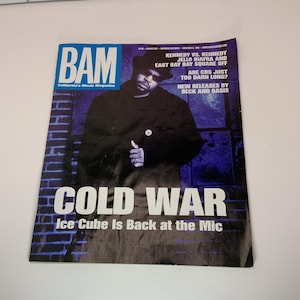 May include: A copy of BAM magazine featuring Ice Cube on the cover. The magazine has a blue and white masthead and the title "COLD WAR" in large white letters. The text "Ice Cube Is Back at the Mic" is also visible.