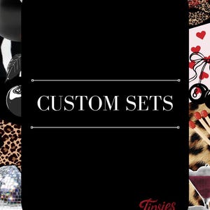 May include: A black rectangular sign with rounded corners featuring the white text CUSTOM SETS centred between two horizontal lines. The background is a collage of leopard print, disco balls, red lips, cherries, dice, and matchsticks.