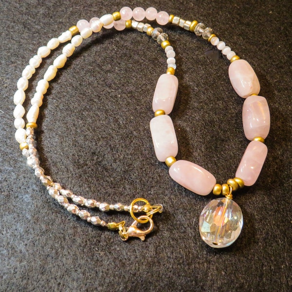 Sundance-inspired necklace with pale pink, pearl, silver, gold, and crystal beads with crystal pendant