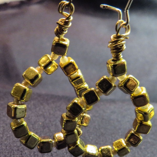 Sundance-inspired drop earrings of gold-colored block beads and pearl seed beads