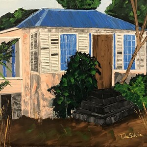 May include: A painting of a small, light pink house with a blue roof and white shutters. The house has a wooden door and is surrounded by lush green foliage. The painting is signed "T. de Silvia" in the lower right corner.