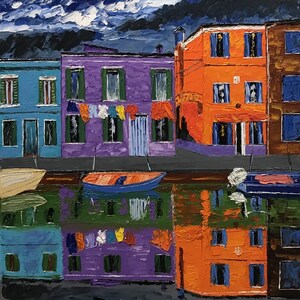May include: A painting of colorful houses reflected in a canal. The houses are painted in shades of blue, purple, orange, and brown. The sky is dark blue with white clouds. The painting is signed "T.de Silva".