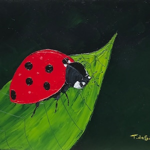 May include: A red ladybug with black spots sits on a green leaf against a dark green background. The ladybug's head is black with white markings.