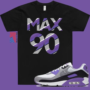 May include: Black t-shirt with "MAX 90" printed in purple, gray, and white stripes.  A pair of white, gray, and purple Nike Air Max 90 sneakers.