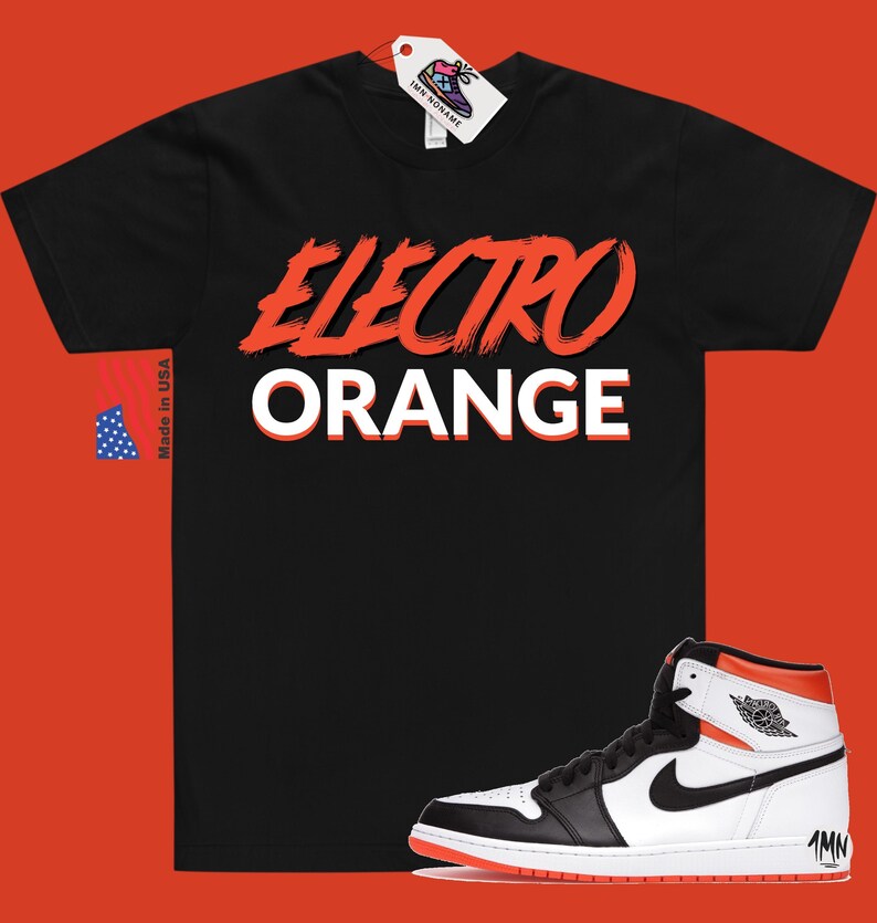 May include: Black t-shirt with "ELECTRO ORANGE" in red and white lettering. A pair of white, black, and orange high-top trainers with a black swoosh logo.