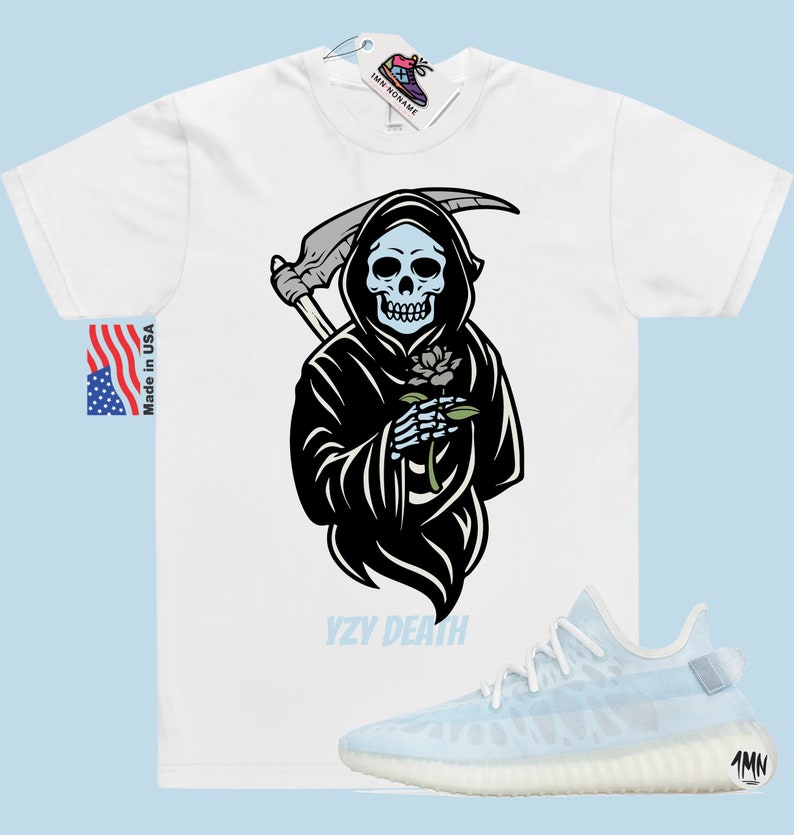 May include: White t-shirt featuring a black and white illustration of the Grim Reaper holding a flower. The text "YZY DEATH" is printed below the illustration. A pair of light blue Yeezy trainers are shown below the t-shirt.