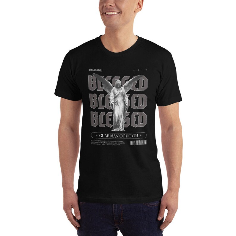 May include: Black t-shirt with a graphic print of a winged angel statue and the text "Blessed" repeated four times. The text "Guardian of Death" is also printed on the shirt.