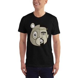 May include: Black t-shirt with a graphic of a bear head with a crown of thorns and a man's face on the right side of the head.