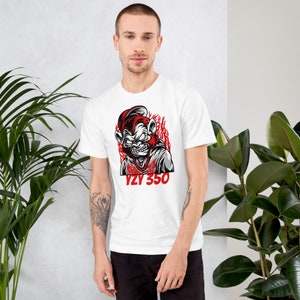 May include: White t-shirt with a red and black graphic of a monkey with flames behind it. The text "YZF 350" is printed in red below the graphic.