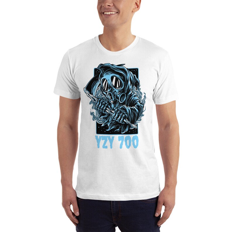 May include: White t-shirt with a blue graphic of a hooded figure wearing a gas mask and holding a scythe. The text "YZY 700" is printed below the graphic.