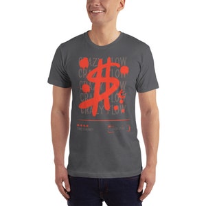 May include: A dark grey t-shirt with a red dollar sign graphic and the text "CRAZY FLOW" repeated multiple times. The text "TIME IS MONEY" and "CASH FLOW" are also printed on the shirt.
