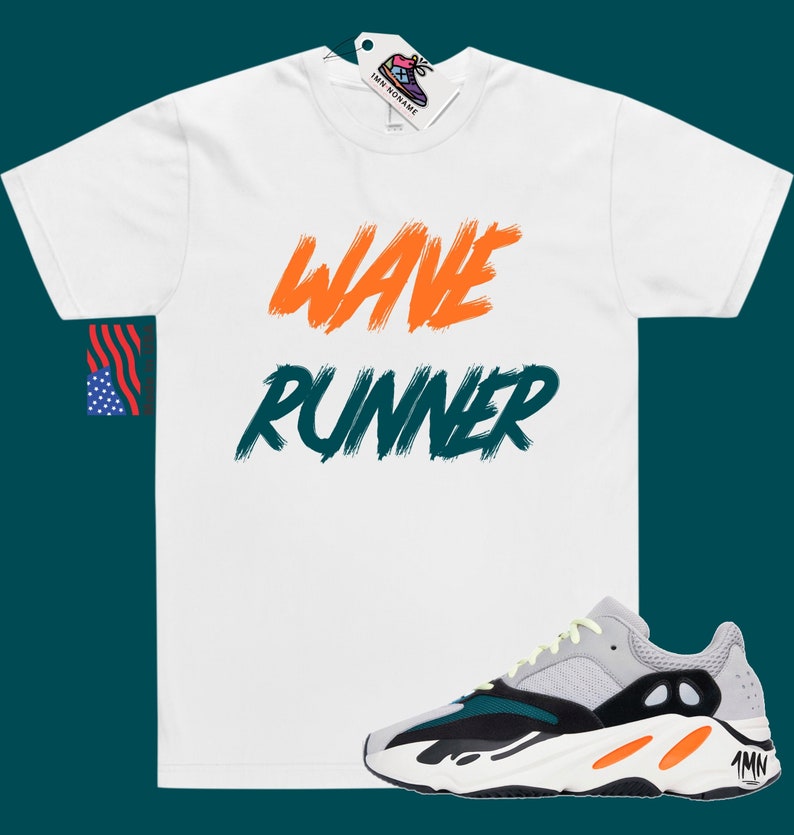 May include: White t-shirt with "WAVE RUNNER" written in orange and green paint. A pair of grey, black, and orange sneakers with a yellow accent.