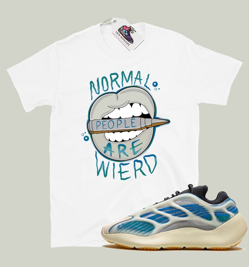 May include: White t-shirt with a graphic of a mouth with a crayon that says "People are weird" and a pair of blue and white sneakers.