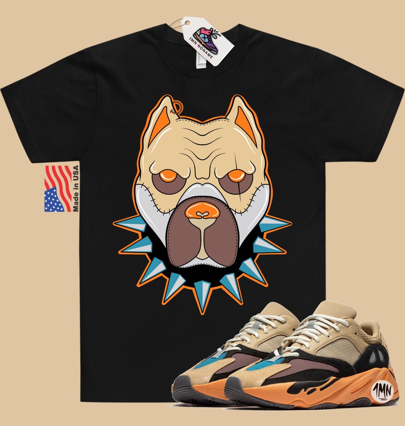 May include: Black t-shirt with a cartoon illustration of a dog wearing a spiked collar. The dog has orange eyes and a brown nose.  A pair of tan, orange, and blue sneakers with the text "1MN" on the side.