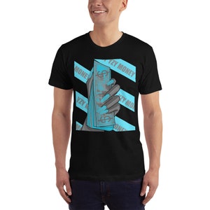 May include: Black t-shirt with a graphic of a hand holding a stack of bills. The graphic is in shades of blue and gray. The text "YZY MONEY" is repeated across the shirt in a blue and white stripe pattern.