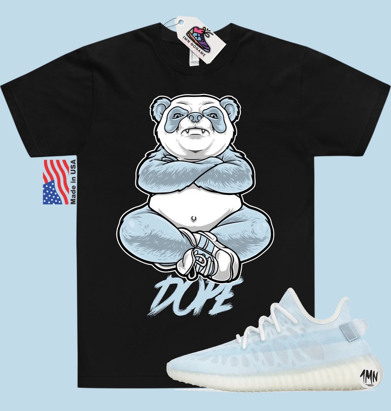May include: Black t-shirt featuring a blue panda illustration and the word "DOPE" printed on the front. A pair of light blue and white trainers are shown below the t-shirt.
