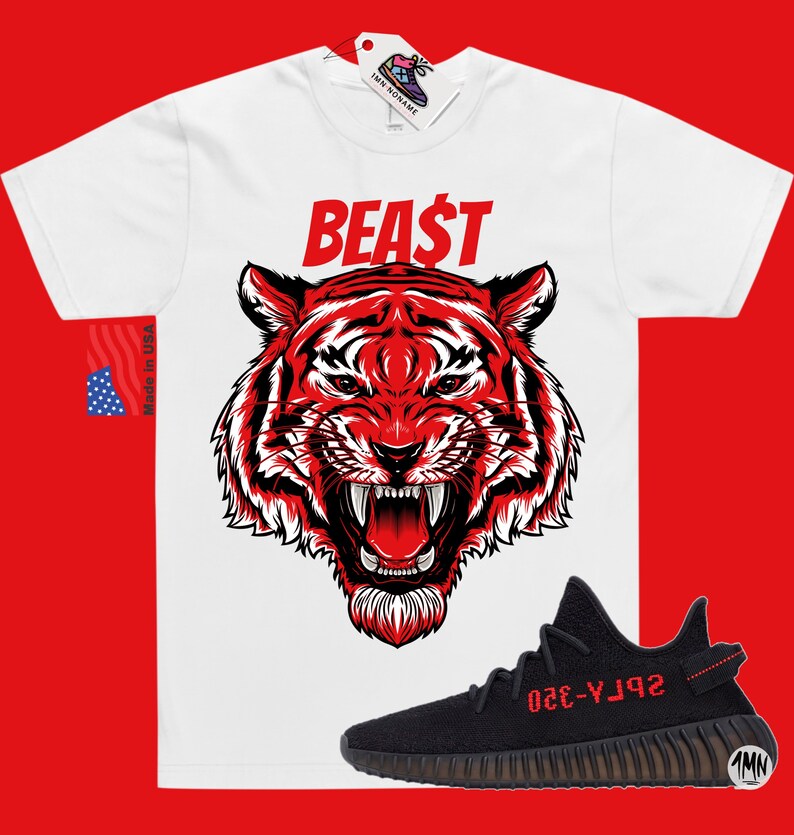 May include: White t-shirt with a red tiger graphic and the word "BEAST" in red. A black and red Yeezy 350 Boost sneaker is shown below the t-shirt.