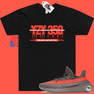 May include: Black t-shirt with a red graphic that says "YZY 350 BELUGA REFLECTIVE". A pair of grey and orange Yeezy 350 Beluga Reflective sneakers are shown below the t-shirt.