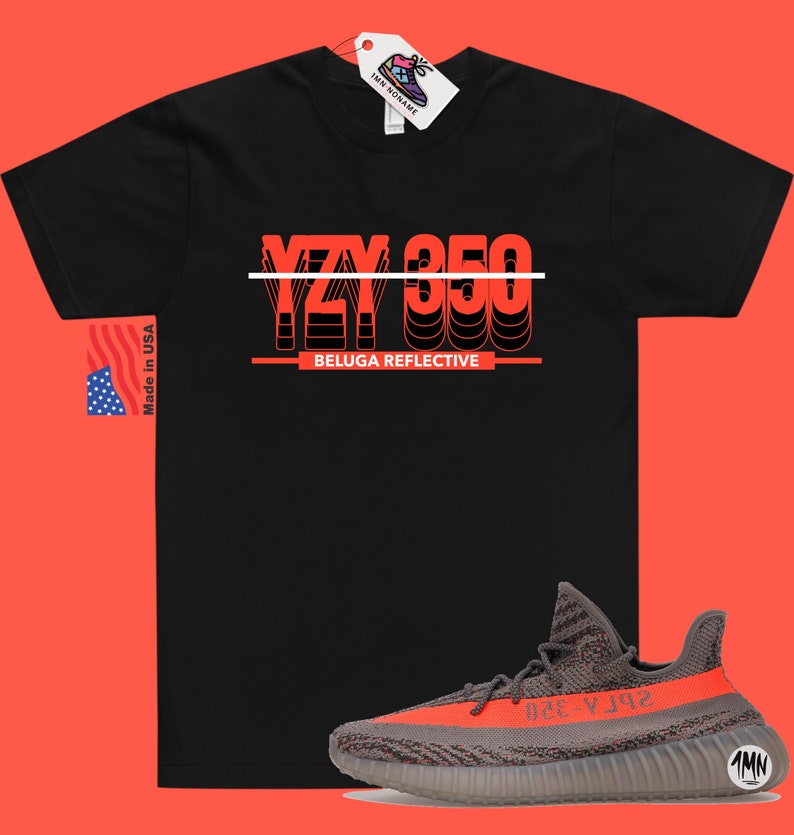 May include: Black t-shirt with a red graphic that says "YZY 350 BELUGA REFLECTIVE". A pair of grey and orange Yeezy 350 Beluga Reflective sneakers are shown below the t-shirt.