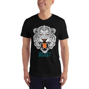 May include: Black t-shirt featuring a white roaring lion graphic and the word "BEAST" in teal text.