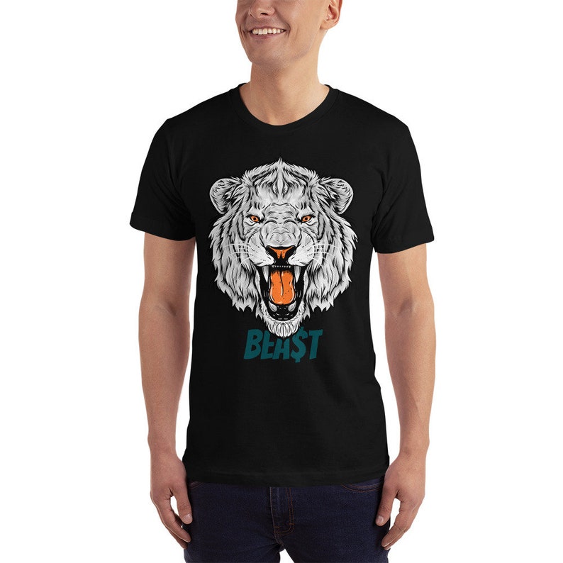 May include: Black t-shirt featuring a white roaring lion graphic and the word "BEAST" in teal text.