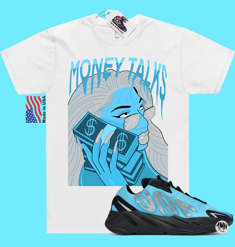 May include: White t-shirt with a blue and gray illustration of a woman with sunglasses holding a stack of money. The text "MONEY TALKS" is above the illustration. A pair of black and blue sneakers with a silver logo are in the bottom right corner of the image.