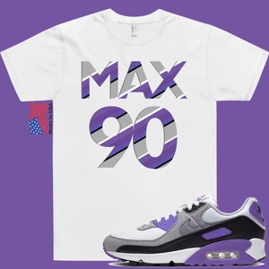 May include: White t-shirt with the text "MAX 90" in purple, gray, and black stripes.  A pair of white, gray, and purple Nike Air Max 90 sneakers.