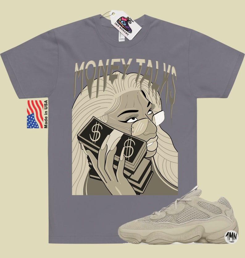 May include: A gray t-shirt with a graphic of a woman holding a stack of money with the text "Money Talks" printed on the shirt. A pair of beige sneakers with a mesh design are also pictured.