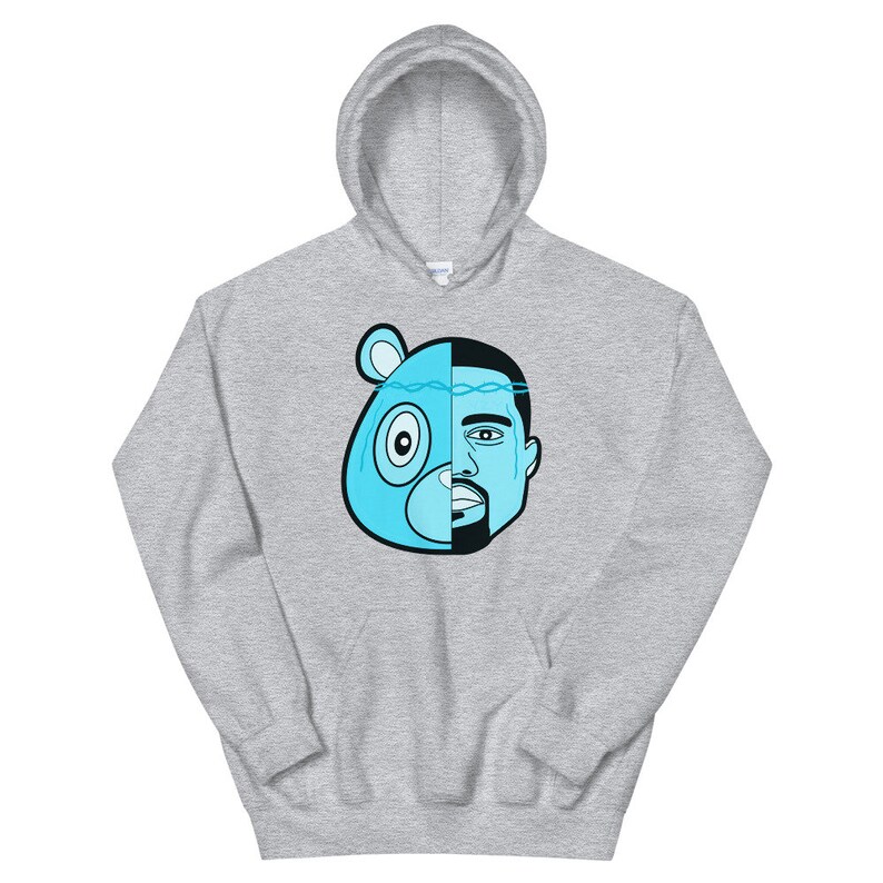 May include: A gray hoodie with a blue and black illustration of a bear head and a man's face. The bear head is on the left side of the image and the man's face is on the right side of the image. The bear head has a blue crown with a chain.