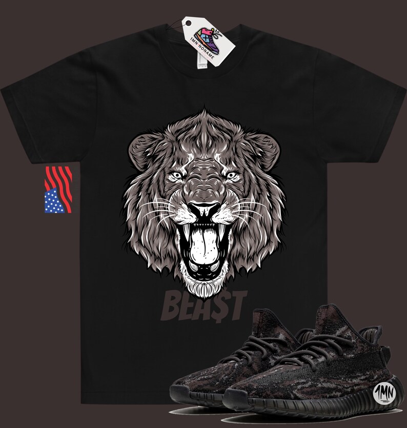 May include: Black t-shirt with a graphic of a roaring lion's head and the word "BEAST" underneath. A pair of black and brown camouflage sneakers are shown below the graphic.