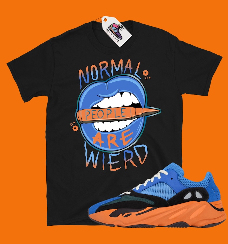 May include: Black t-shirt with a blue mouth graphic and the text "Normal People Are Wierd".  A pair of blue and orange sneakers with black accents.