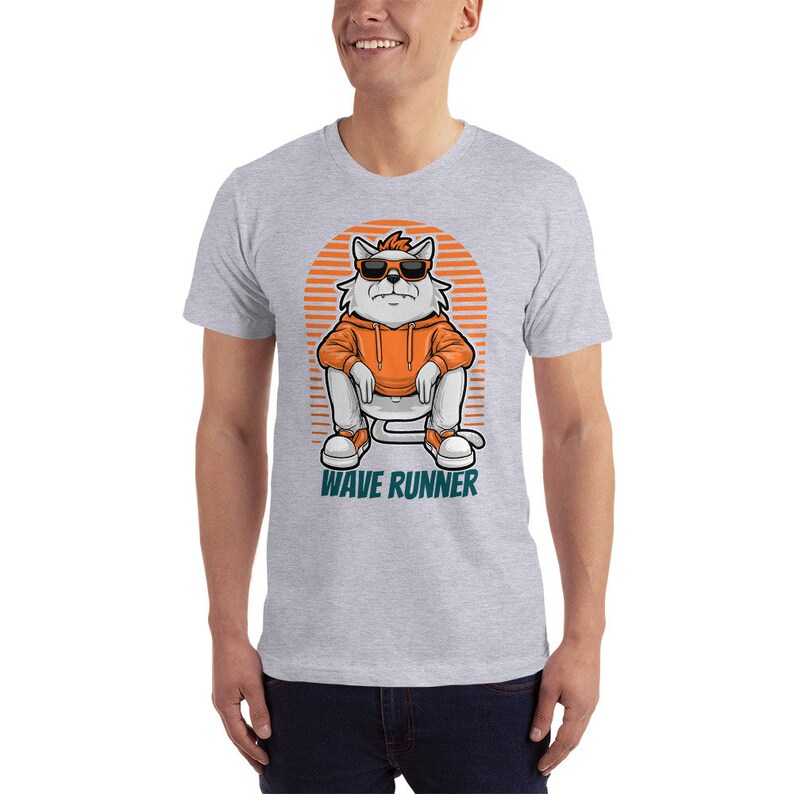 May include: A gray t-shirt with a cartoon illustration of a white cat wearing sunglasses and an orange hoodie. The cat is sitting on a white platform with the text "WAVE RUNNER" below it.