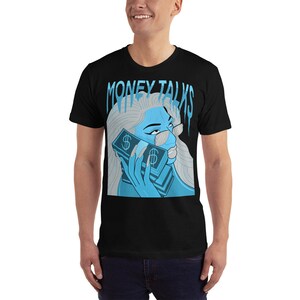 May include: Black t-shirt with a blue graphic of a woman holding a stack of money with the text "MONEY TALKS" above her.
