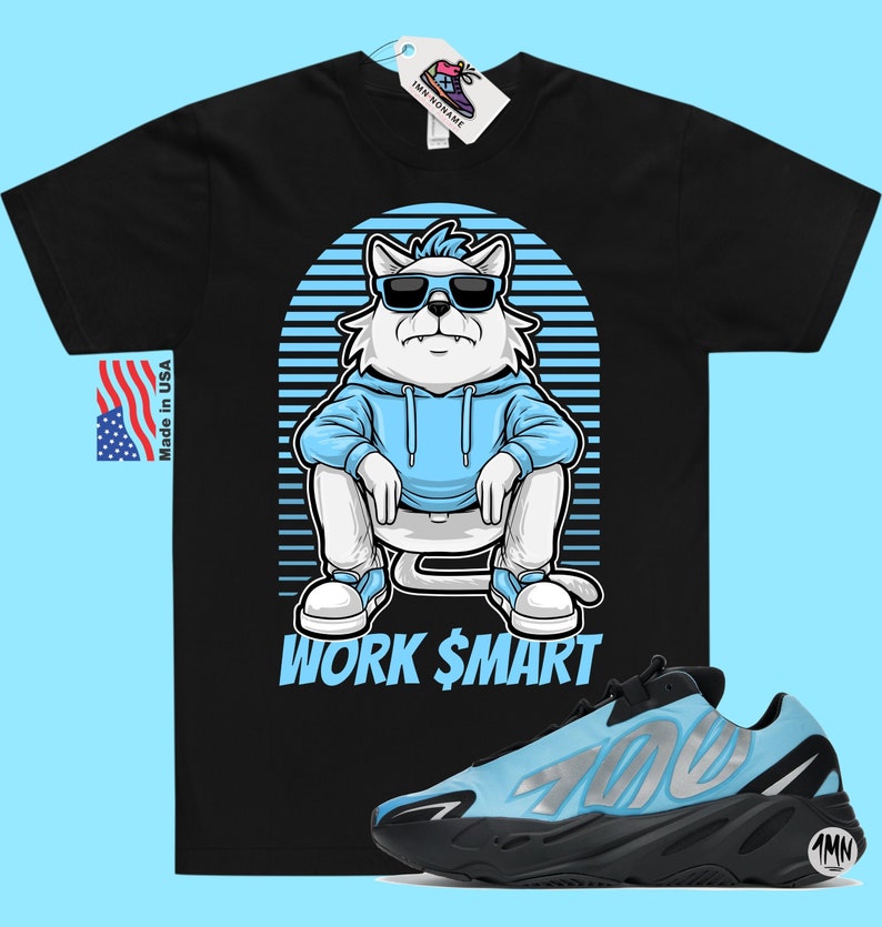 May include: Black t-shirt featuring a cartoon cat wearing sunglasses and a blue hoodie. The cat is sitting with the text "WORK $MART" underneath. A pair of blue and black trainers are shown below the t-shirt.