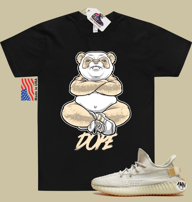 May include: Black t-shirt with a cartoon panda wearing a white shoe and the word "DOPE" printed in beige. A pair of beige sneakers with a white sole and a beige tag with the text "1MN" are shown in the bottom right corner of the image.