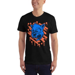 May include: A black t-shirt with a blue and orange graphic of an angry cartoon wolf's head with dripping paint.