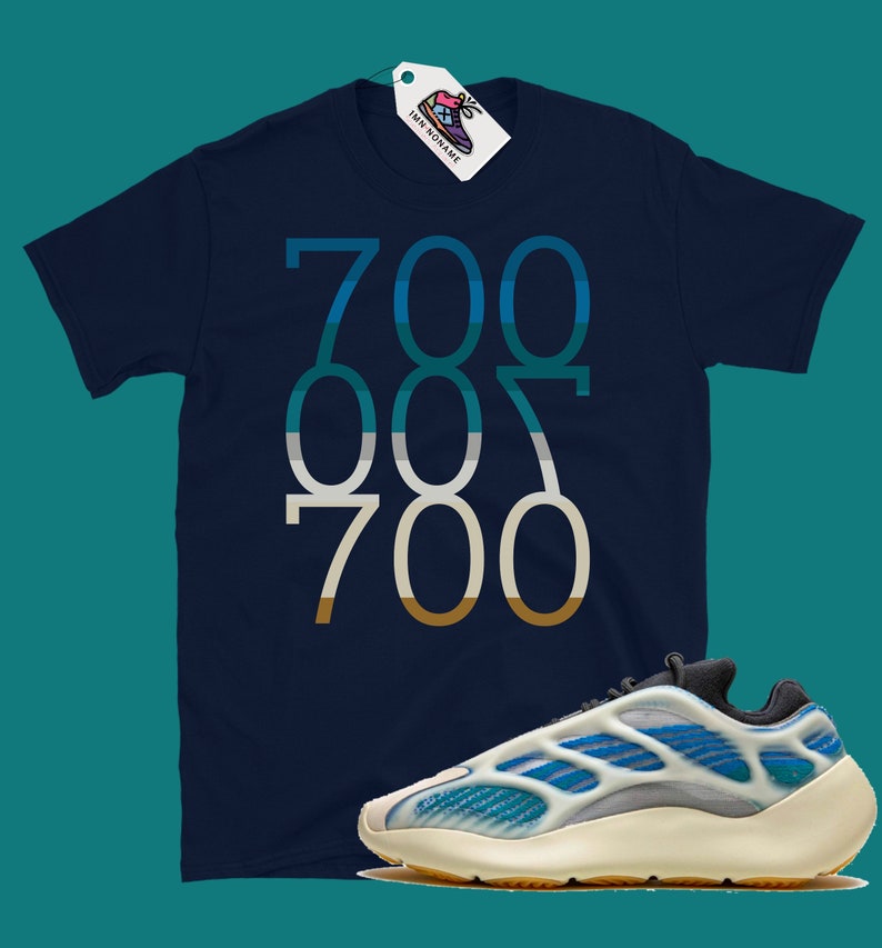 May include: A navy blue t-shirt with the numbers "700 007 700" printed in a gradient of blue, green, and brown. A pair of white and blue trainers with a black sole.