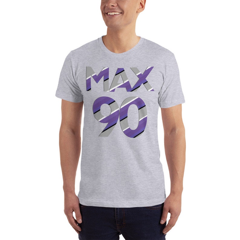 May include: A gray t-shirt with a purple and white striped design that says "MAX 90" on the front.