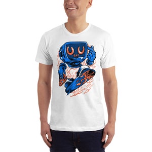 May include: White t-shirt with a blue cartoon character that looks like a television with a surprised expression. The character is holding a video game controller and is skateboarding on a board with flames.