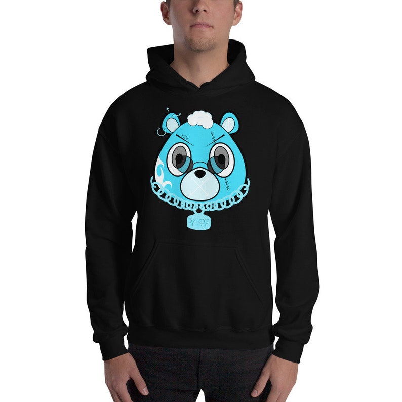 May include: A black hoodie with a blue cartoon bear wearing a chain with a pendant that says "YZY".
