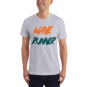 May include: A heather grey t-shirt with the words "WAVE RUNNER" printed in orange and teal.