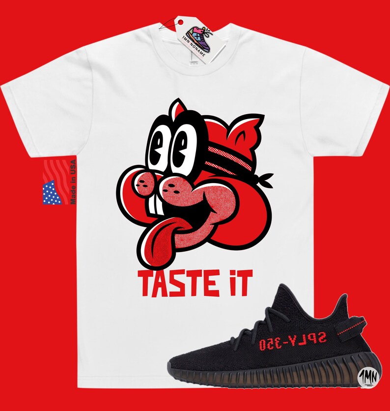 May include: White t-shirt with a red cartoon character with the text "TASTE IT" and a black and red Yeezy sneaker with the text "YZY-350" on the side.