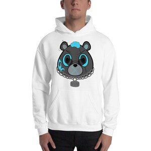 May include: White hooded sweatshirt with a black and blue cartoon bear head graphic. The bear has a chain around its neck with a tag that says "YEA".