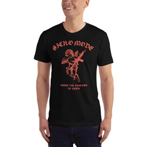 May include: Black t-shirt with a red graphic of a cherub holding a rifle. The text "Sicko Mode" and "Under the Shadows of Death" is printed in red.